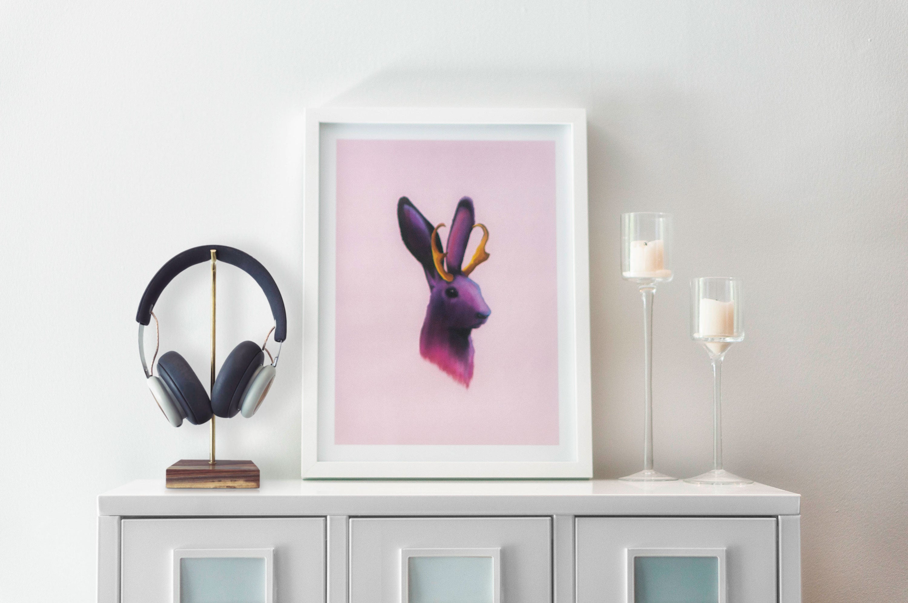 Jackalope on a sideboard with headphones